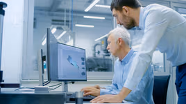 Design engineers designing metal parts with CAD files