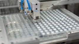 Dynacast injected metal assembly machine