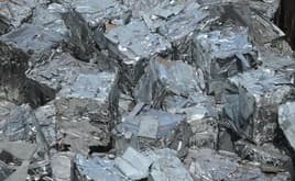 Compacted recycled aluminum in a scrap yard