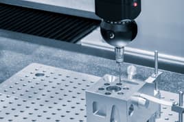 CNC Machining tool engraving on a metal part