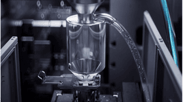 Metal chips moving through thixomolding machine